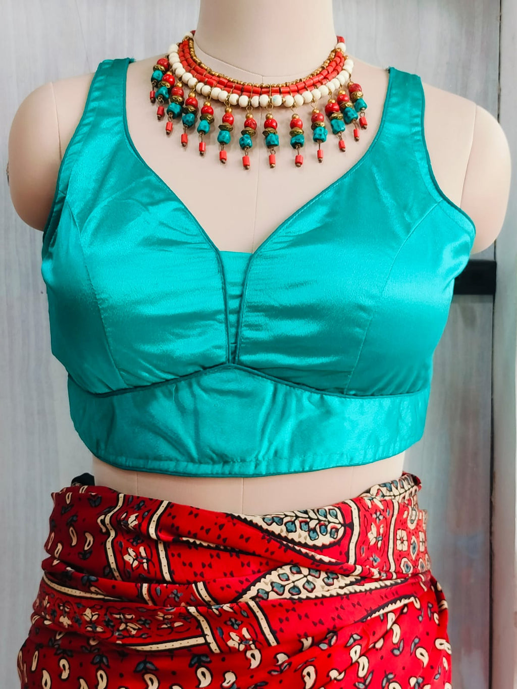 Close front view showing the shaped neckline and satin finish