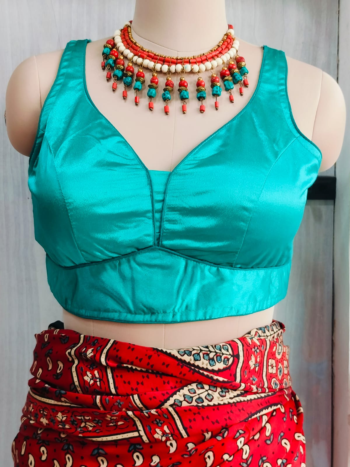 Close front view showing the shaped neckline and satin finish