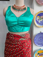 Front view of turquoise satin padded blouse