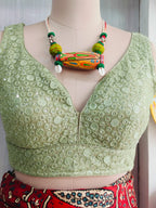 Front detail showing sequin and circular embroidery motifs