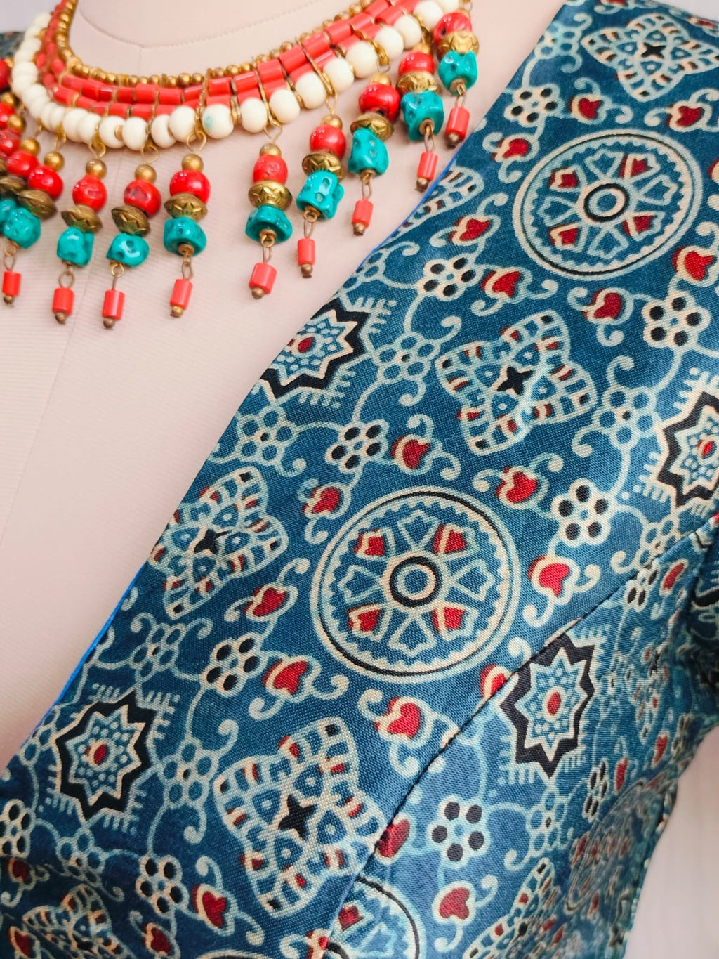 Full front styling view of teal modal blouse