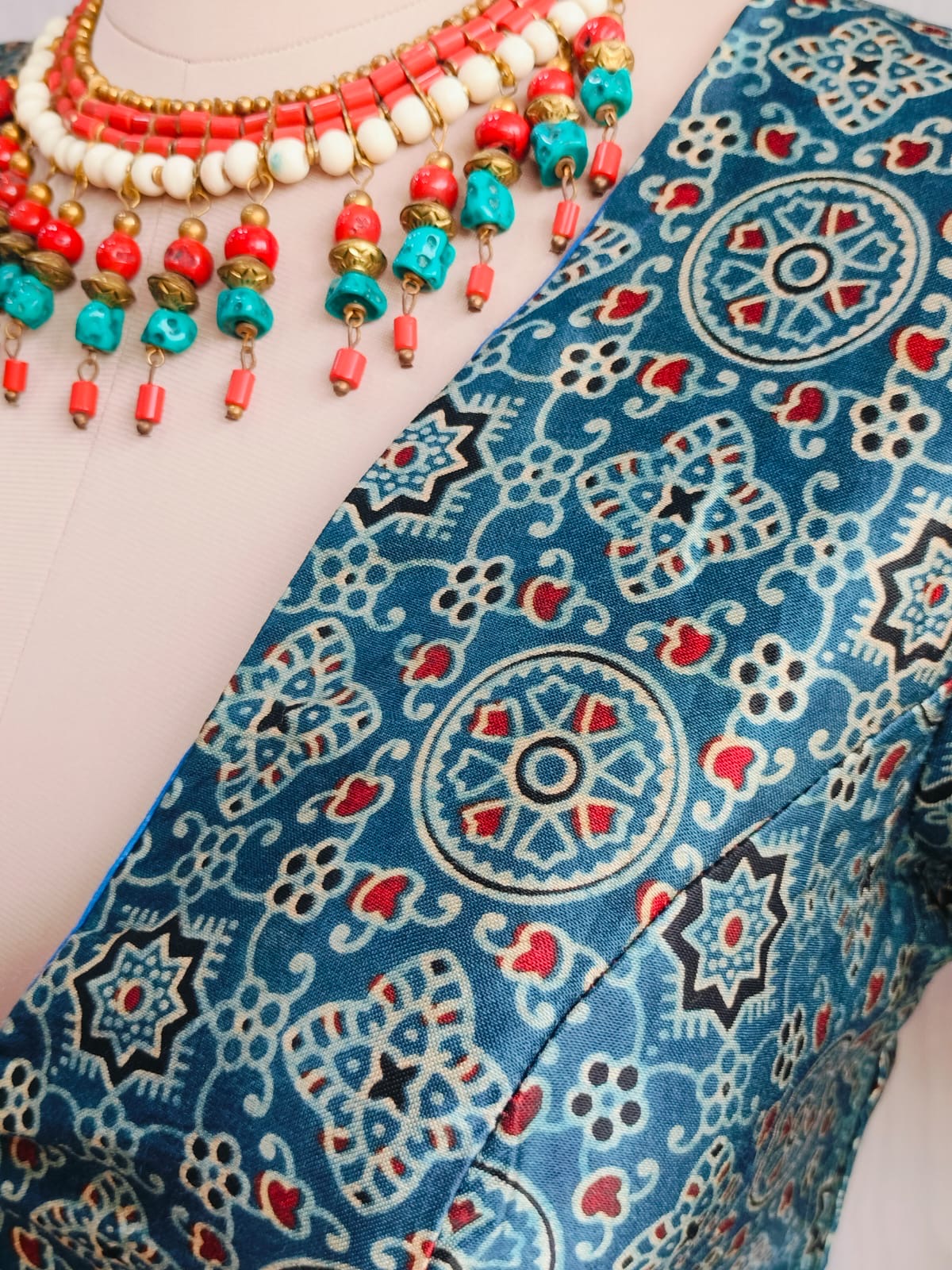 Full front styling view of teal modal blouse