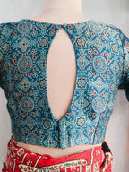 Close-up of deep V neckline and printed fabric
