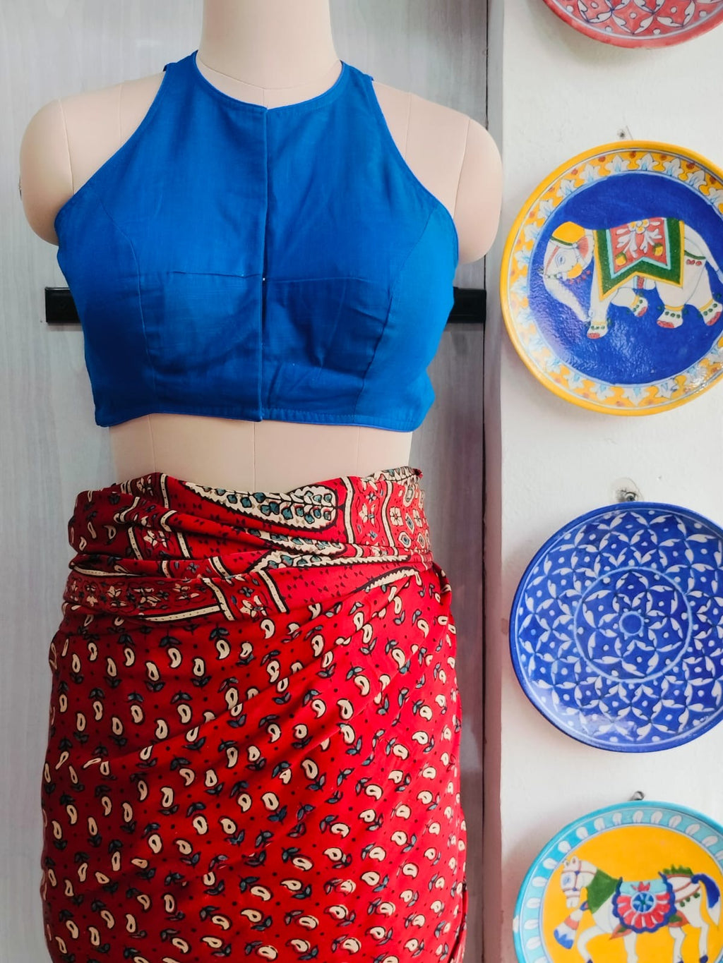 Front view of royal blue cotton padded razor-cut blouse
