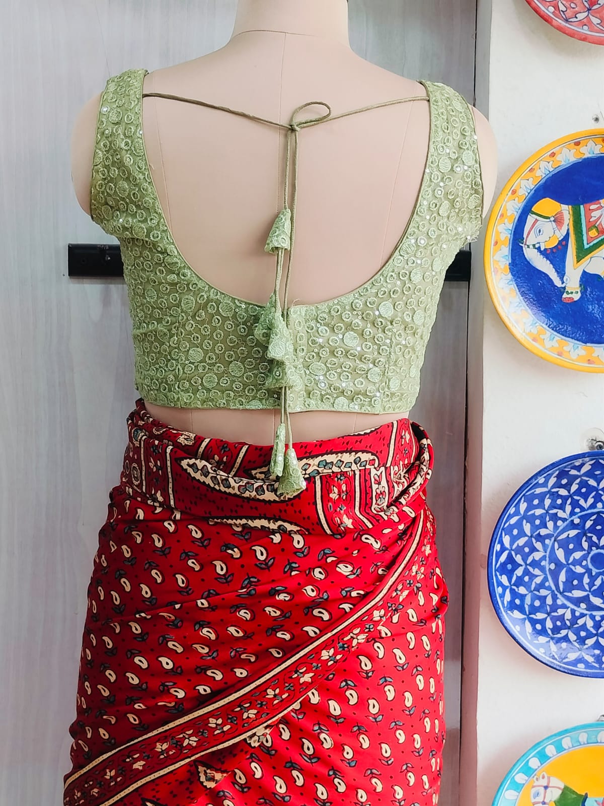 Full back view of pista green blouse
