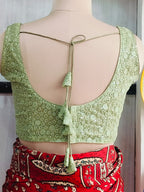 Back detail of green blouse with matching tassel tie-up cords