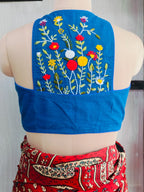 Back view of royal blue blouse with colourful floral hand embroidery